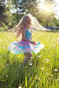 carefree cheerful child daisies